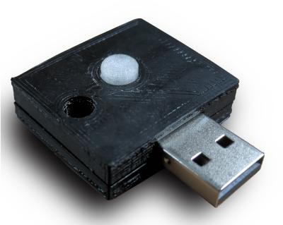 A small USB device with a black case and translucent button